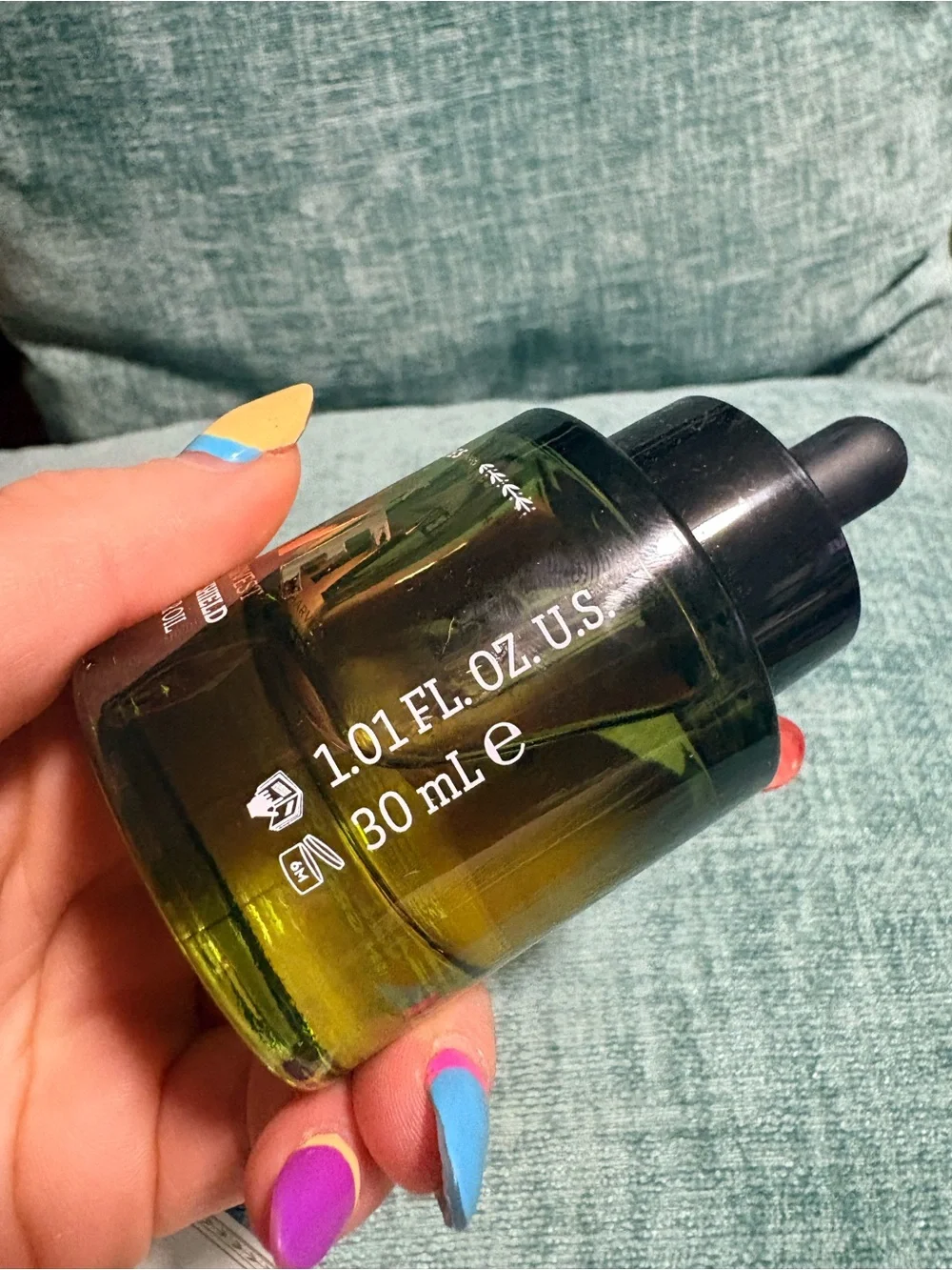 Korres Pure Greek Olive Vitality Shield Booster Oil — green and black